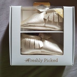 Toddler rose gold moccasins never been worn!